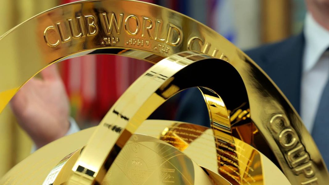 WASHINGTON, DC - MARCH 07: The 2025 Club World Cup trophy is unveiled during a executive order signing ceremony with U.S. President Donald Trump and President of Fédération Internationale de Football Association (FIFA) Gianni Infantino in the Oval Office at the White House on March 07, 2025 in Washington, DC. President Trump signed an executive order establishing a White House Task Force for the 2026 World Cup.